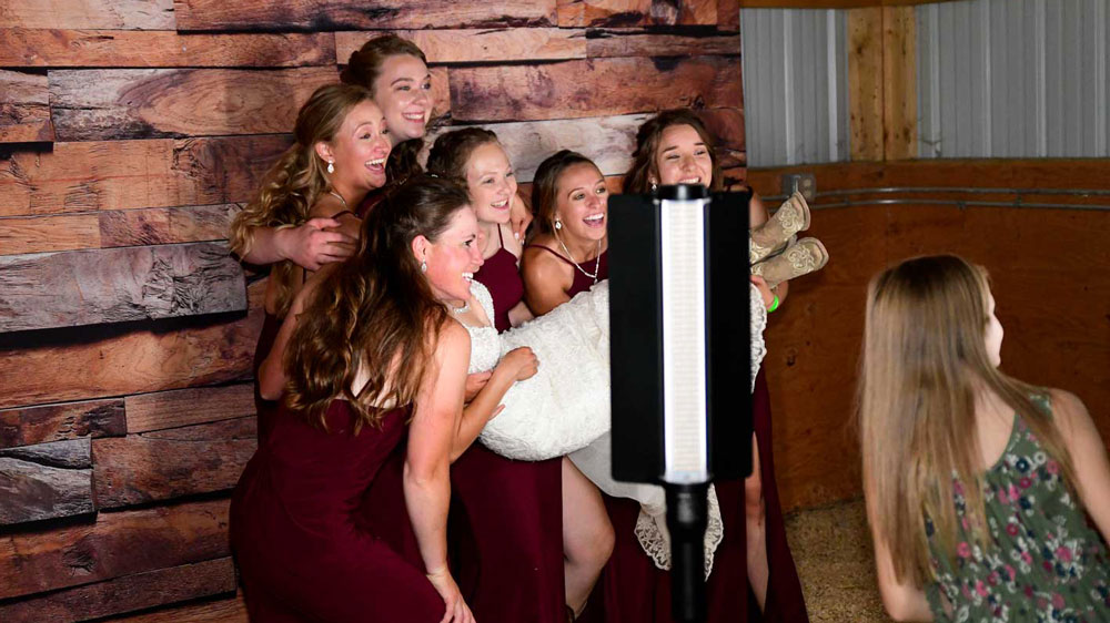 Wedding guests using the photo booth